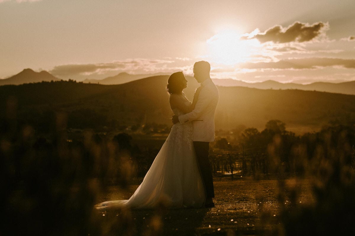 Sun setting in Scenic Rim on bride and groom